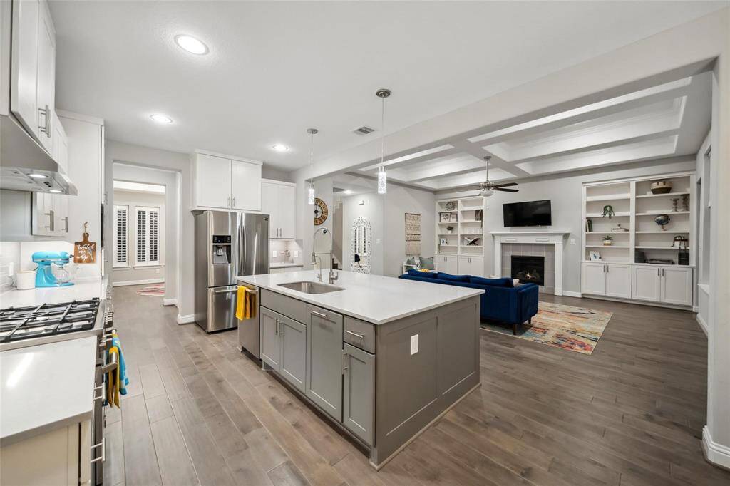Step into a kitchen designed for both beauty and function, with an expansive island, abundant storage, and thoughtful details throughout.