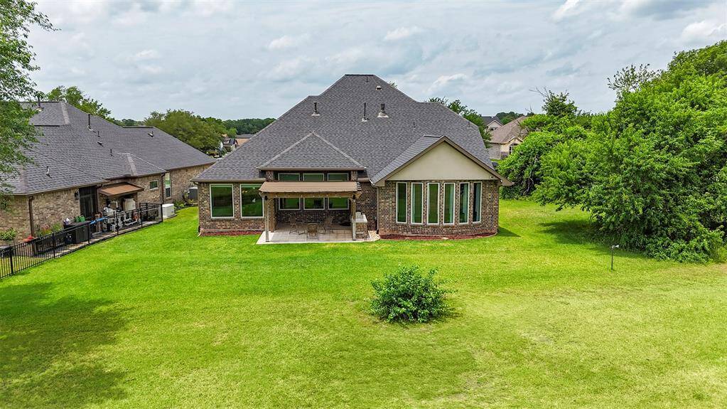 The expansive backyard offers plenty of room for hosting, gardening, or creating your own backyard oasis tailored to your lifestyle.