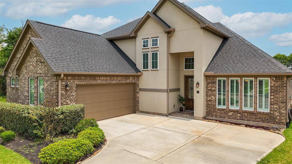 Twilight charm meets modern elegance—this 2020-built home features a stunning brick and stucco facade, a lush, manicured lawn, and a spacious side-load garage with room for two cars plus a dedicated golf cart bay.