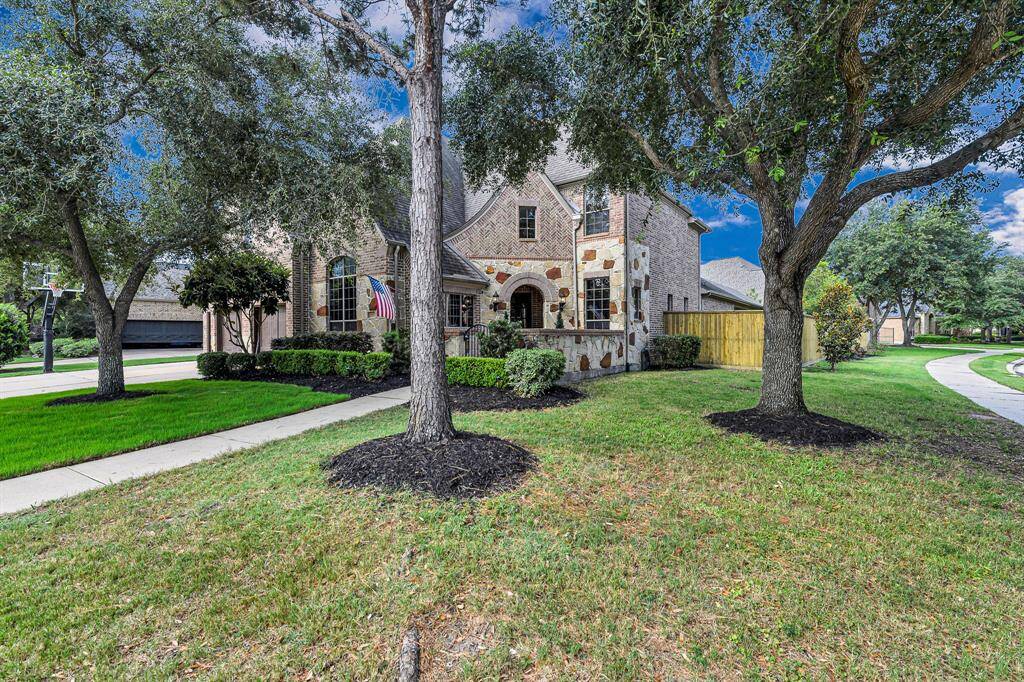 Welcome home to this Cinco Ranch Stunner zoned to highly sought after Seven Lakes Highschool. This home built by Highland has 6 bedrooms and 6 full baths plus a powder room. Set on a corner lot with mature trees this is the perfect home for your family.