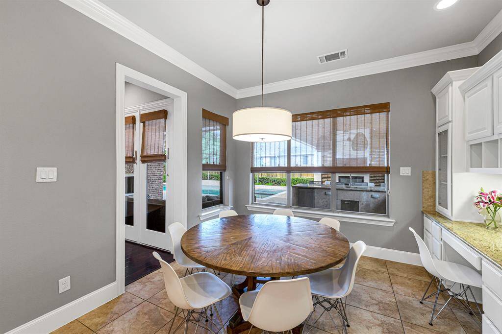Breakfast area with enough space for a large table.  Notice the workspace tucked away in the corner.  So many special details in this home.