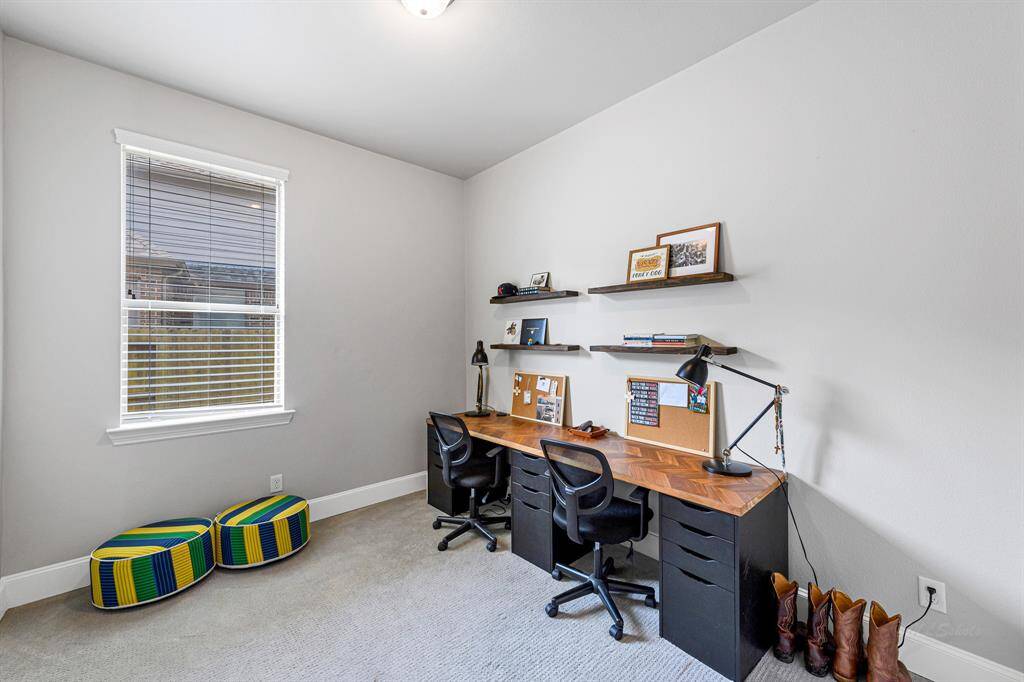 This is the downstairs guest bedroom currently being used as a homework room. There is a full bath and closet for this bedroom on the first floor.