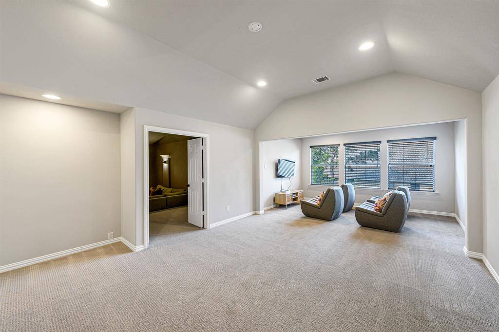 HUGE GAMEROOM upstairs! The possibilities are endless for this space.  The three windows also create a very light and bright space.  Hours of fun for the whole family await in this game room. Notice the double doors leading to the media room.