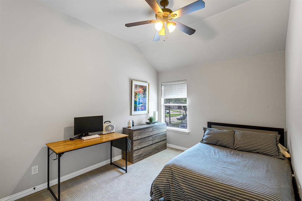 The second of four upstairs bedrooms has enough space for a full size bed, dresser and desk.  This room also has its own bath and closet.