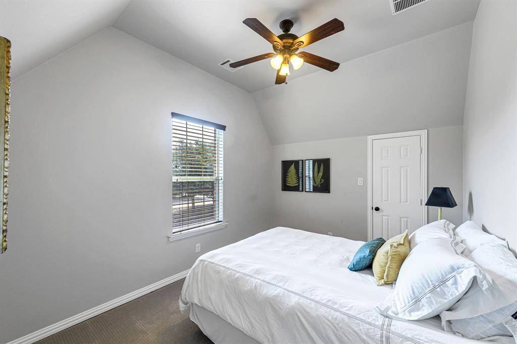 The last of four bedrooms upstairs, also complete with large closet and private bathroom.  Spacious and bright.