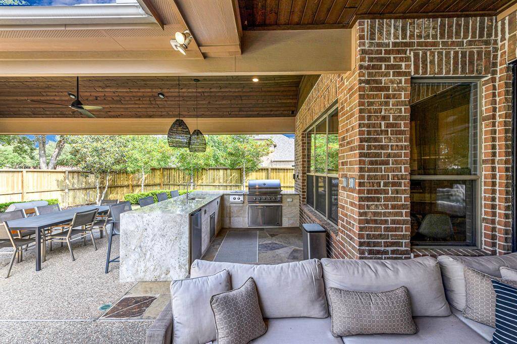 Here is a view of the outdoor kitchen and seating area.