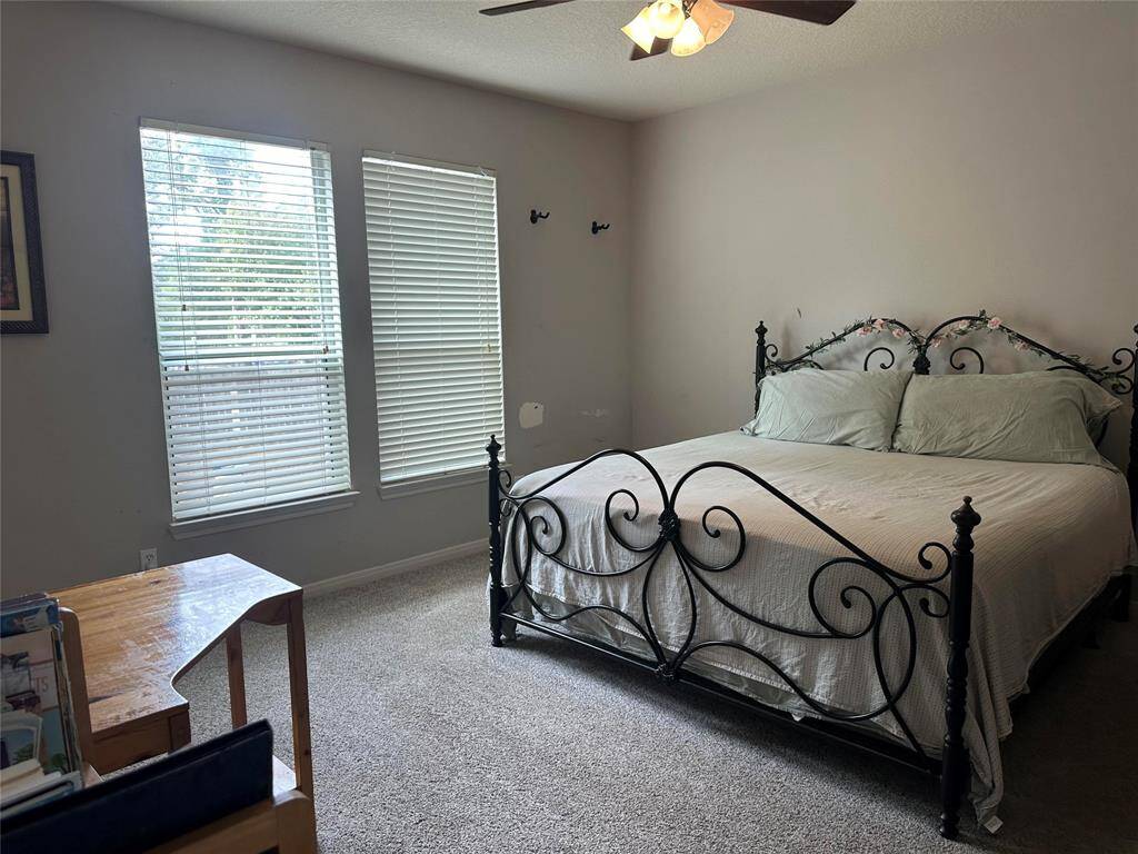 Primary bedroom with ample natural light, en-suite bath and walk in closet.