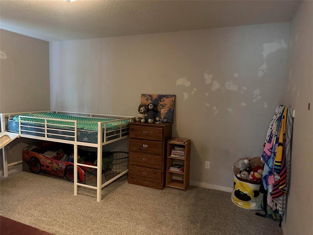 Bedroom 2 is spacious and with a fresh coat of paint will be a great space.