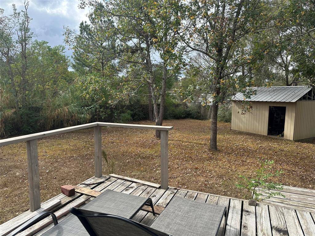 Very spacious, fully fenced backyard area with separate storage that will stay with the home.