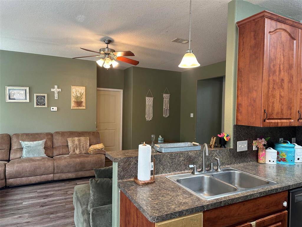Stay connected with your guest with the kitchen opening to the living area.