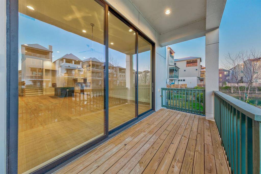 epic 10ft glass sliding doors lead from living room to spacious backyard