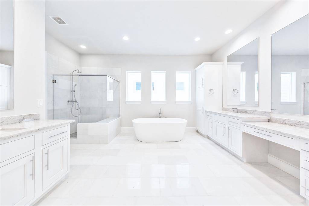 similar spacious white marble bathroom to this one