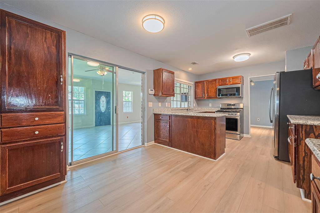 The kitchen with a view of the flex room.