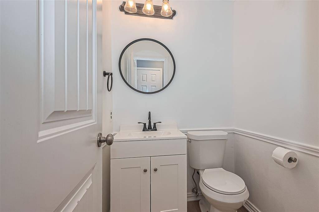 The half bath located downstairs.