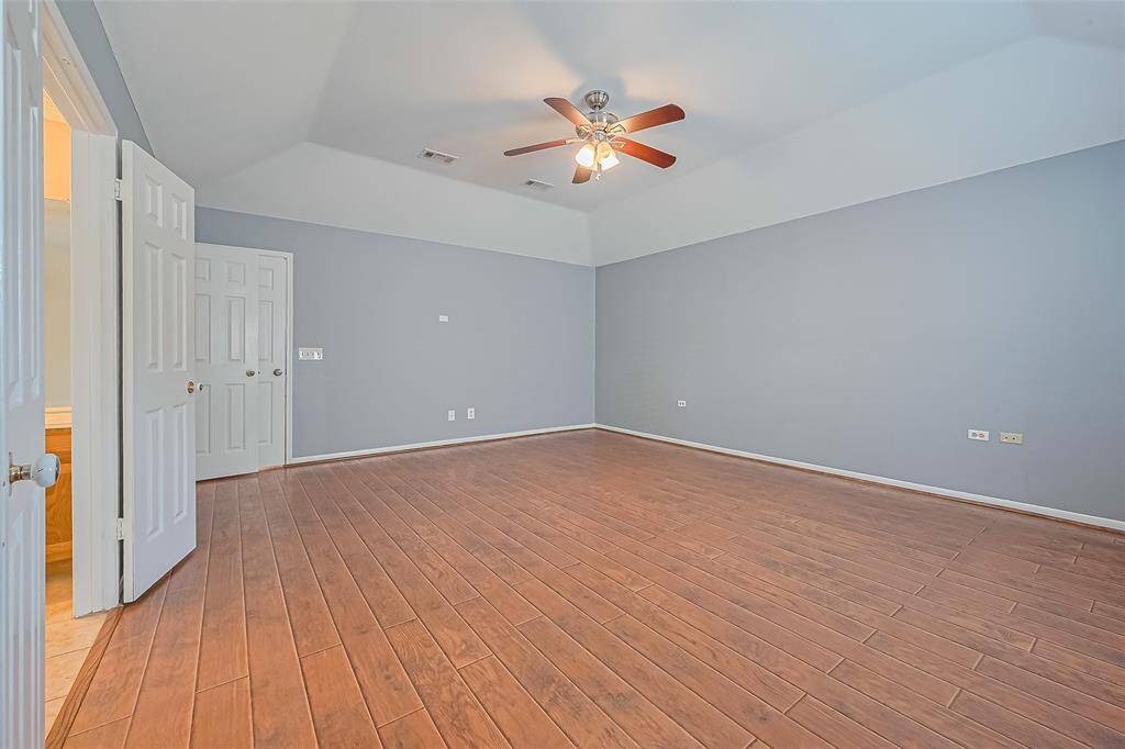 Another view of the primary bedroom.