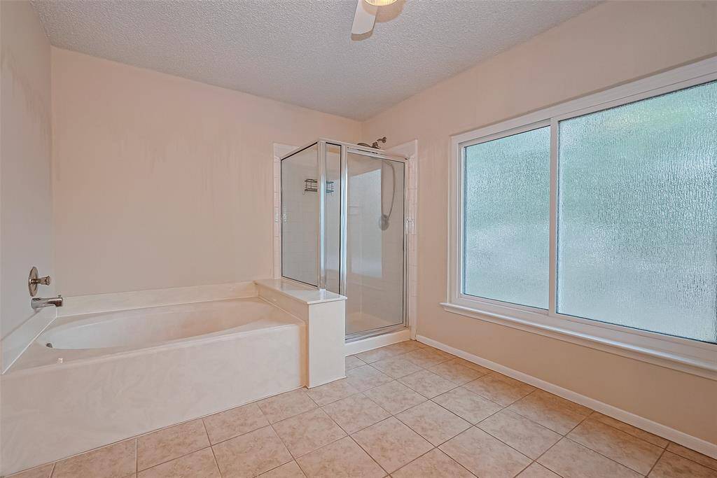 The separate soaking tub and shower.