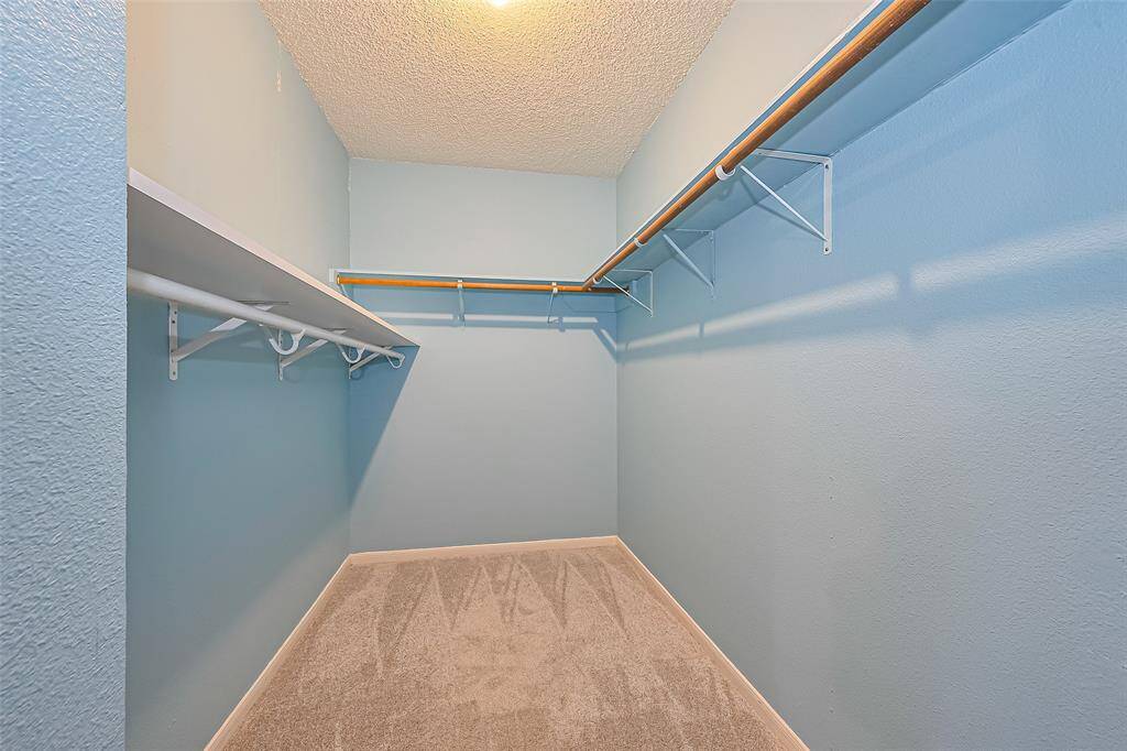 The walk in closet in the primary bedroom.