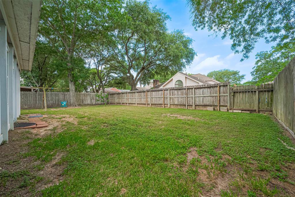 The backyard offers plenty of room to play and entertain.
