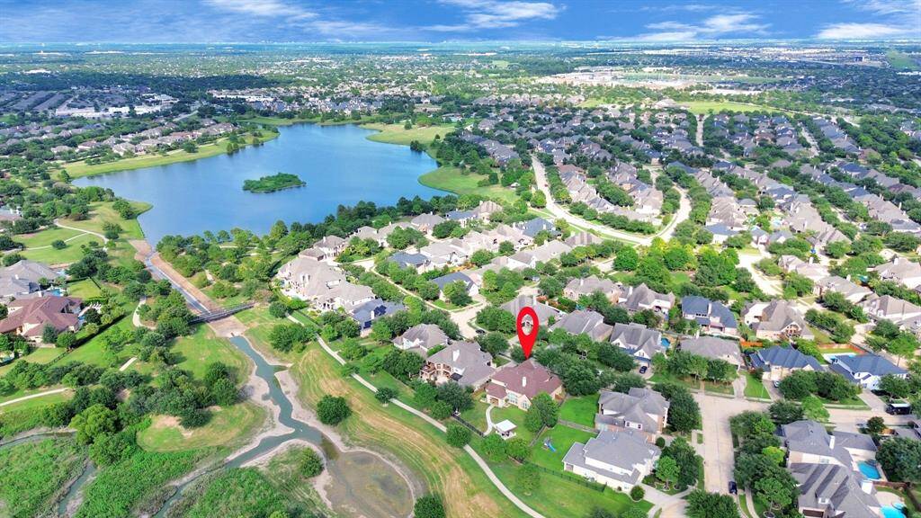 Just a short distance from the estate, the neighborhood lake is a serene and inviting feature of the community. The lake is depicted as a sparkling blue expanse, nestled within a natural setting of trees and green spaces. Its gently curving shoreline is dotted with benches and walking paths, allowing residents to enjoy the tranquil waters and scenic views.