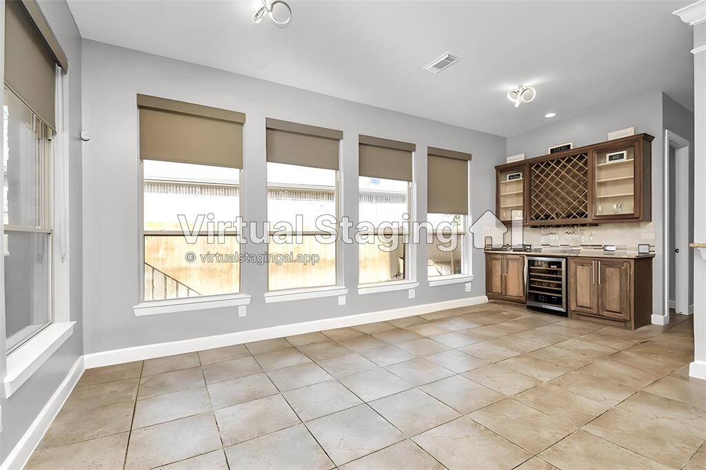 The sun room is a delightful, light-filled space designed to be a serene retreat where natural light and outdoor views are at the forefront. It serves as a versatile area for relaxation, reading, or casual entertaining, seamlessly blending indoor comfort with the beauty of the outdoors.