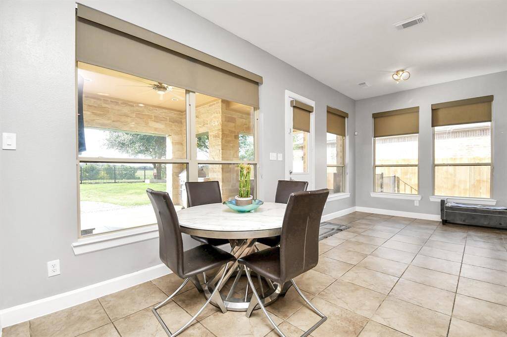 The breakfast area is a charming and functional space designed for casual dining and relaxed mornings. It is thoughtfully integrated into the overall layout of the home, providing a warm and inviting setting for enjoying breakfast and informal meals.