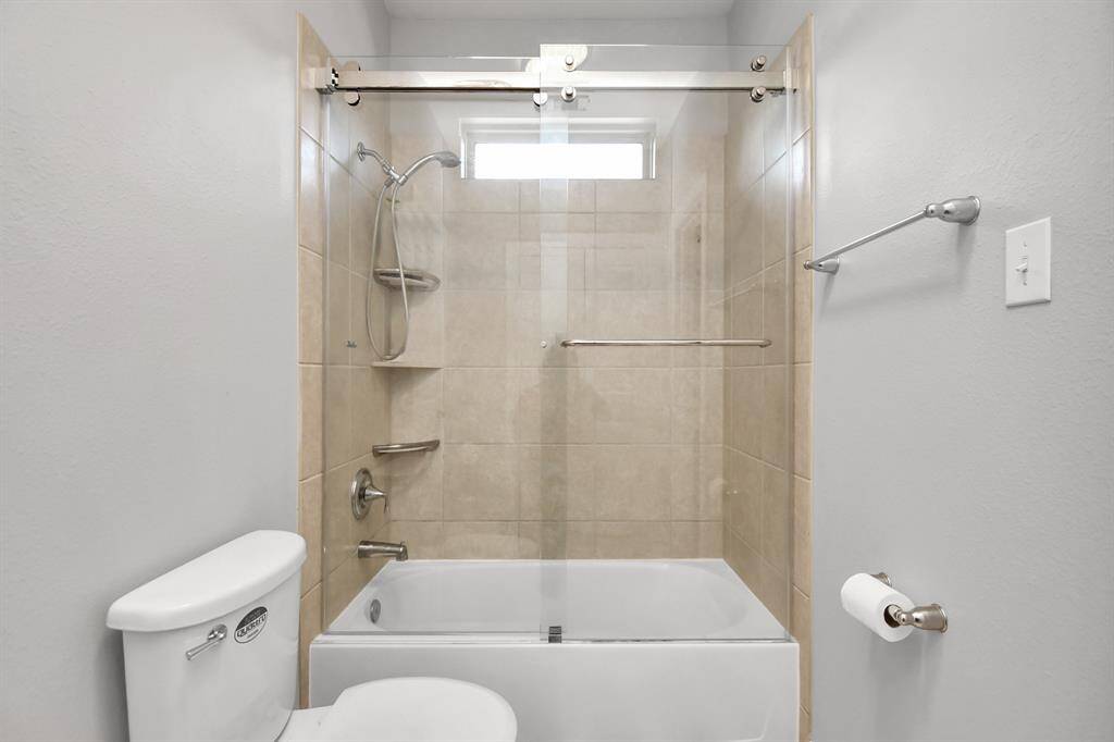 This third bathroom is designed with a balance of style and practicality, making it ideal for family use, guests, or as a secondary bath. Its thoughtful layout and elegant features create a comfortable and attractive space.