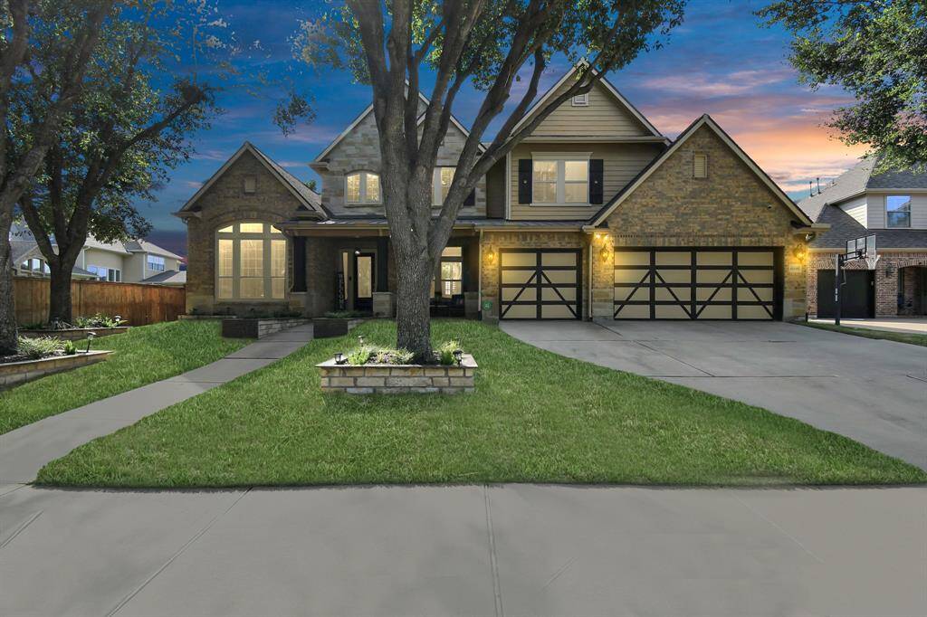 Welcome to Elegance.As you approach this opulent residence, you are greeted by an impressive facade that exudes sophistication and grandeur. The front of the house features a grand entrance with towering columns that frame the elegant arched doorway. At twilight, the property transforms into a shimmering oasis, with landscape lighting casting a soft glow on the carefully chosen features.