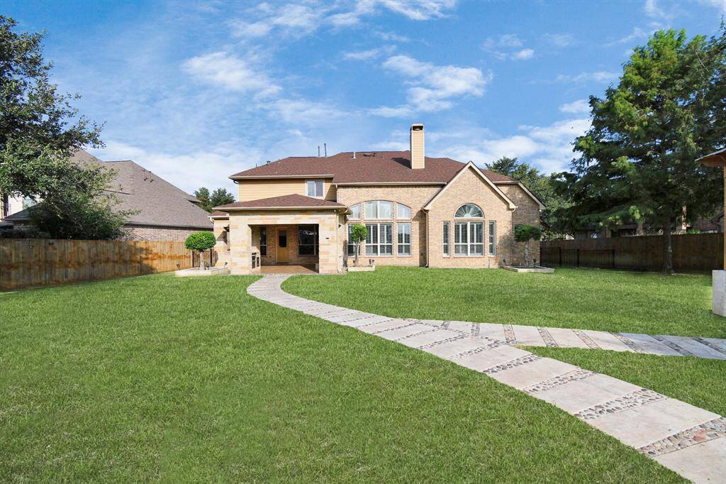 Beautifully designed paths and walkways made from materials like flagstone, gravel, or pavers meander through the backyard, guiding guests through different areas and adding to the overall charm