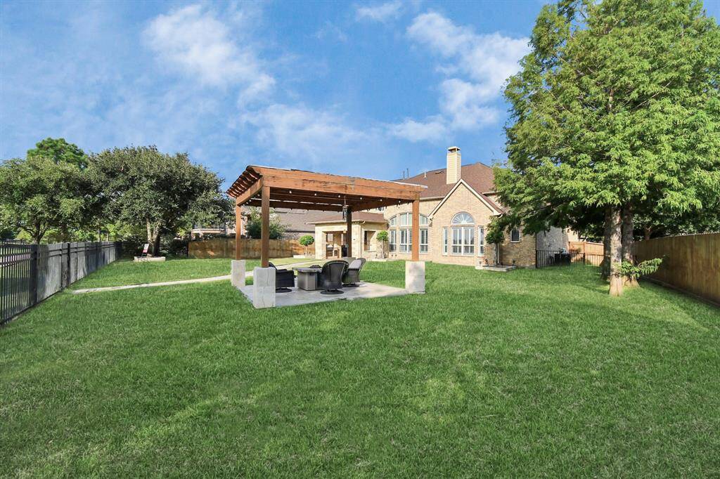 The expansive backyard is a well-designed outdoor retreat that balances functionality with aesthetic appeal. Its diverse features and thoughtful layout cater to relaxation, recreation, and entertainment, making it a perfect space for enjoying the outdoors and hosting memorable gatherings. Big enough to add a swimming pool.