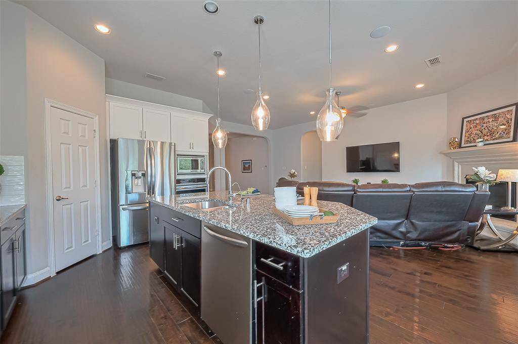 Kitchen creates a natural flow between cooking and dining spaces.