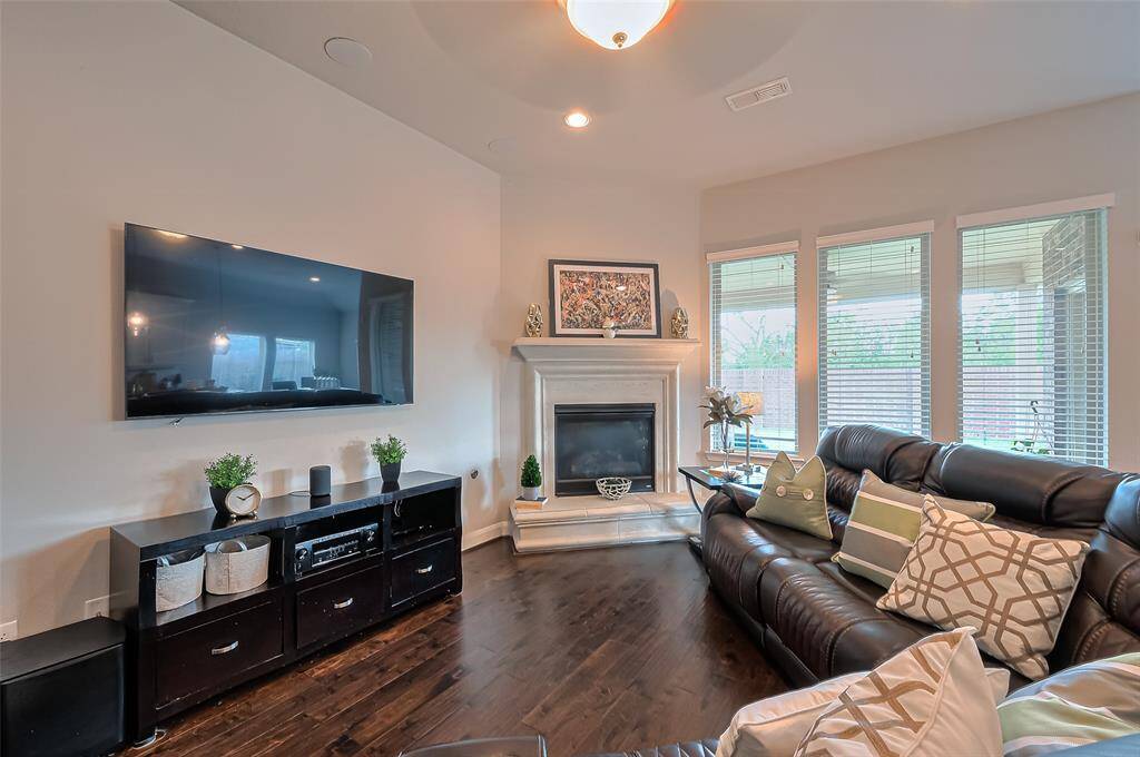 Kitchen features sleek granite countertops and a spacious breakfast bar that offers additional seating, making it perfect for casual dining or entertaining guests. Refrigerator available!