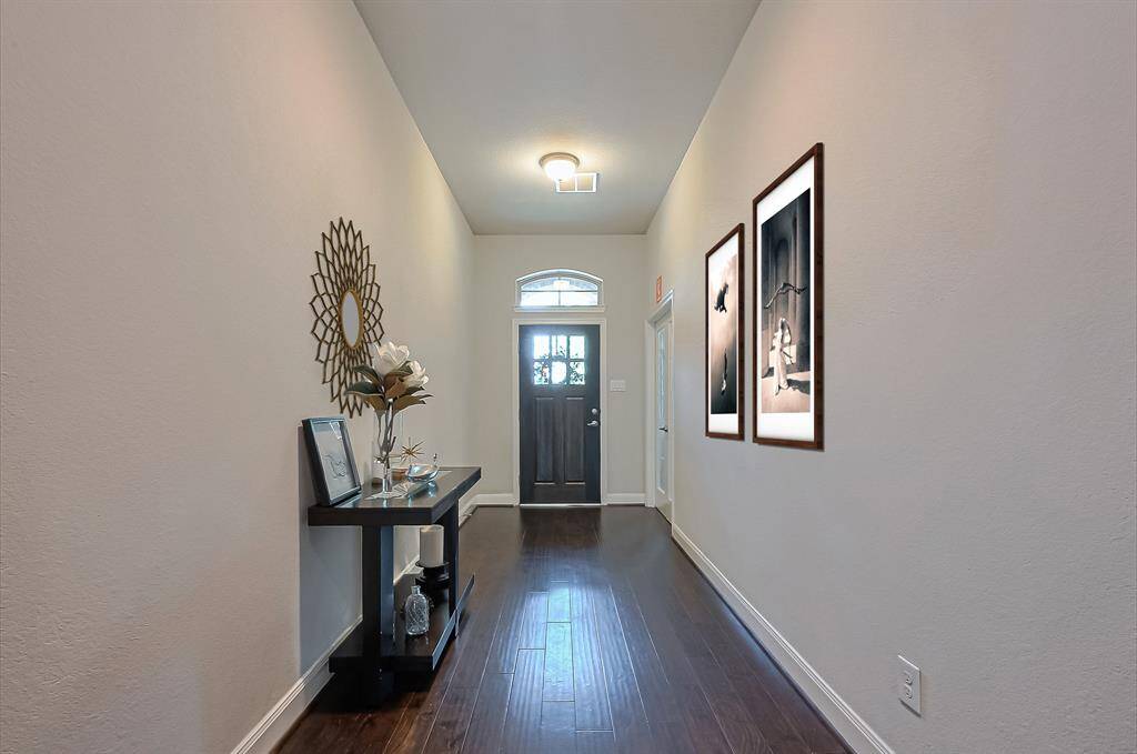 This beautiful home features a 2-car attached garage with a wide driveway, offering ample parking space.
