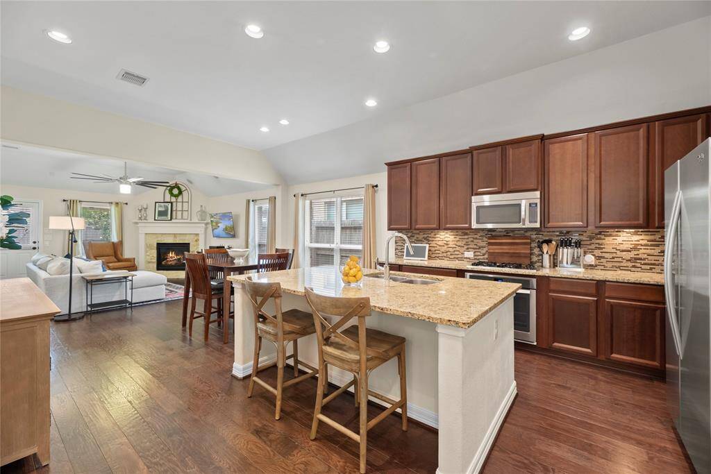 Your sparkling kitchen awaits. Hand scraped wood floors, beautiful, recessed lighting.