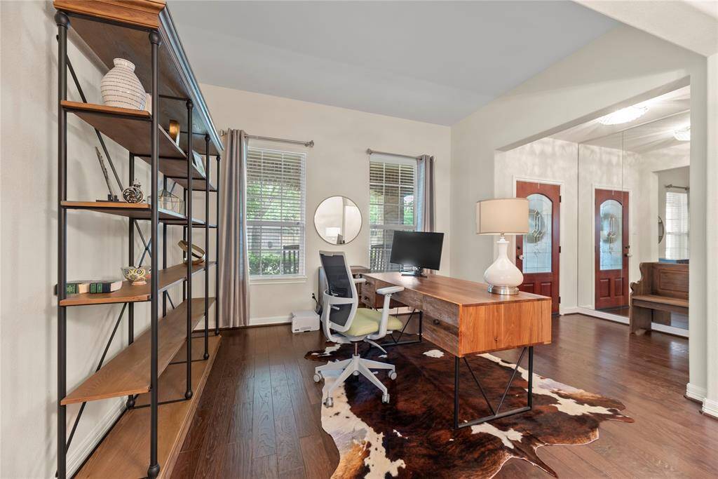 Office/Den at front of home, beautiful view to lush front yard.