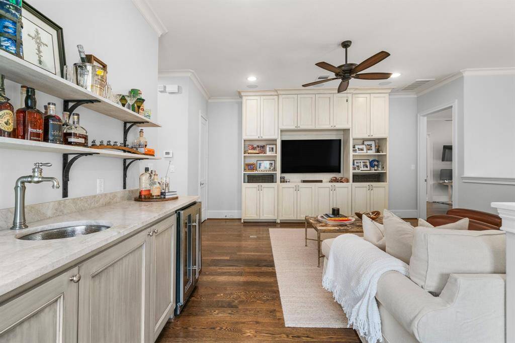 FAMILY ROOM - Upstairs family room with built-in bar, floating shelves and wine refrigerator.