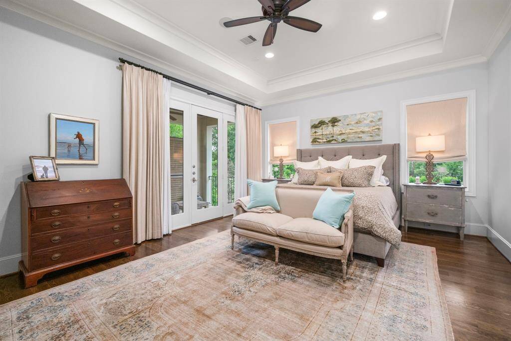 PRIMARY SUITE - So open and such a comfortable bedroom with a private balcony to enjoy seeing the sun rise and overlooks the pond and fountain.