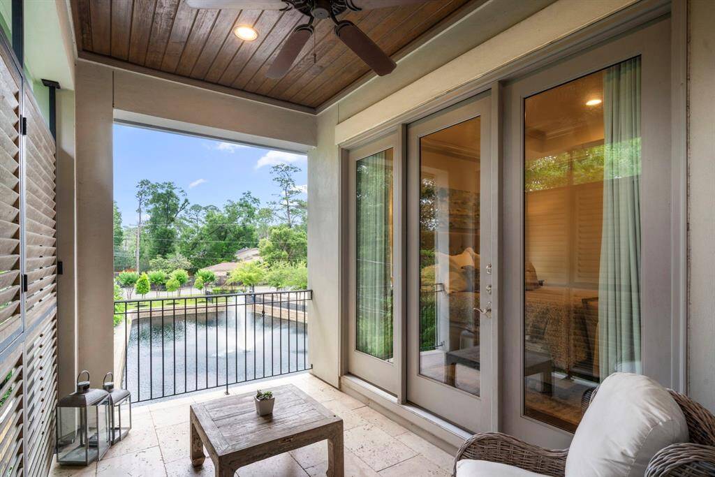 PRIMARY SUITE BALCONY - Just beyond the doors of the primary suite is a private outdoor balcony. Perfect for viewing a beautiful sunrise or enjoying quiet evenings.