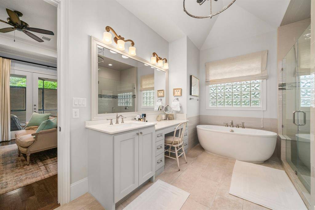 PRIMARY BATHROOM - Primary suite bathroom with two separate sink areas, freestanding tub, gorgeous walk in shower - such a luxurious sanctuary.