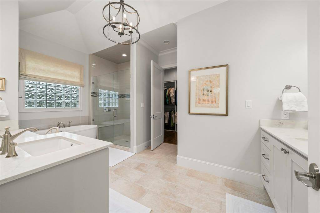 PRIMARY BATHROOM - Very spacious with its two separate sinks and cabinets.