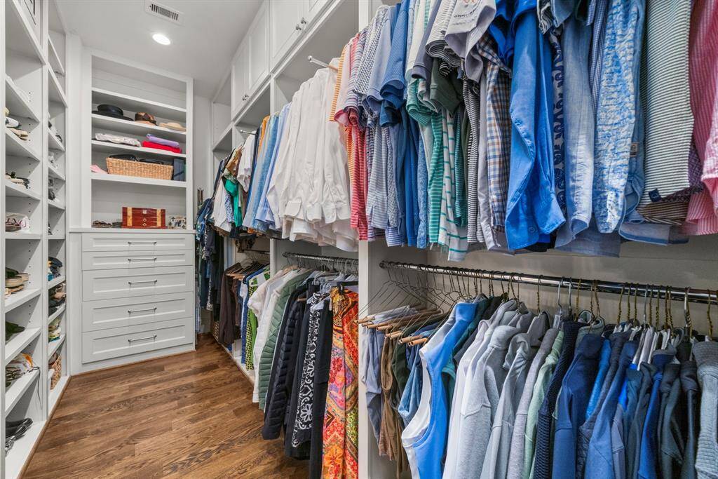 PRIMARY SUITE CLOSET - This expansive walk-in closet was thoughtfully designed for both elegance and function.