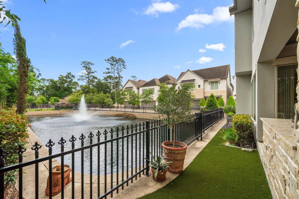 BACK YARD - Such a gorgeous view of the pond, fountain and blue sky!