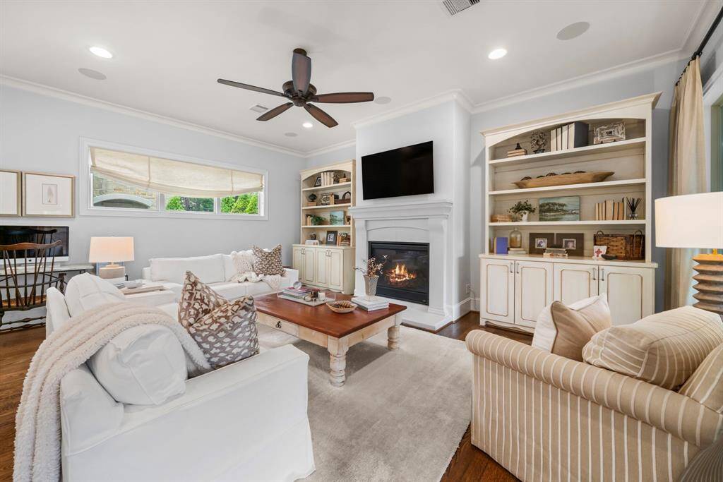 DEN - Such a comfortable and inviting area with custom built-in shelves and gas log fireplace with remote control.
