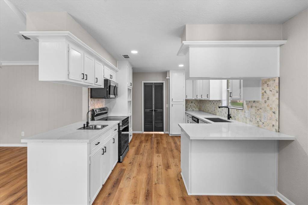 Kitchen with plenty of counter space, quartz countertops and lots of cabinets