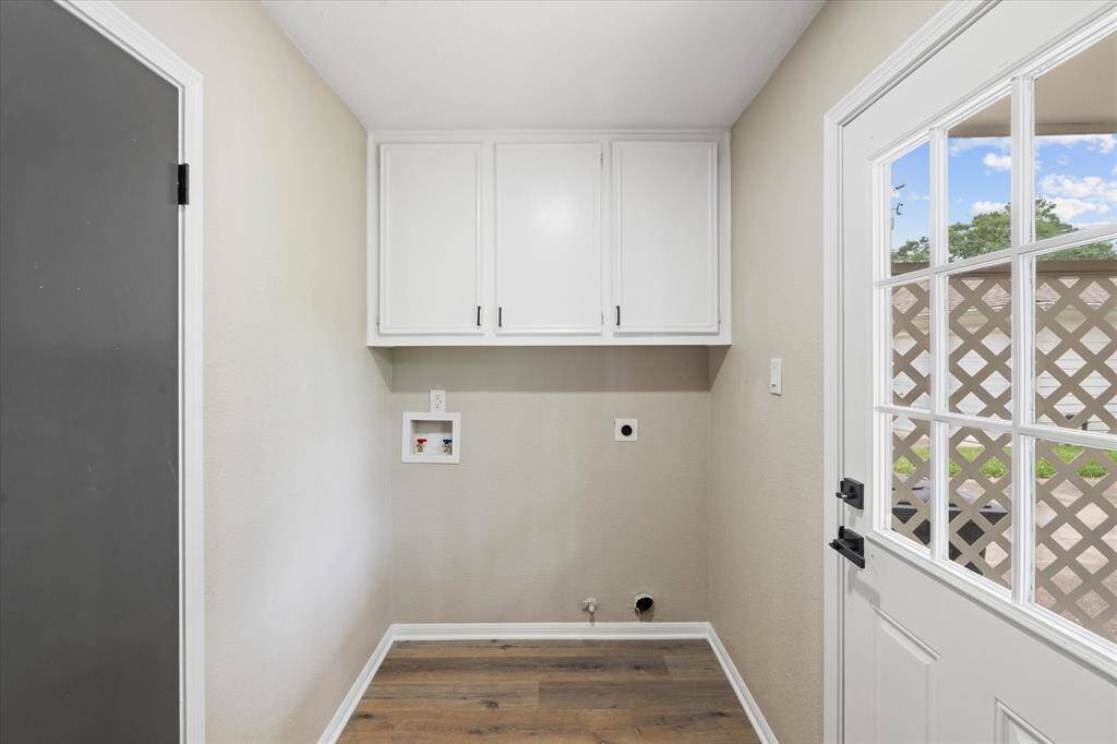 Utility room/laundry room with cabinets inside the house going