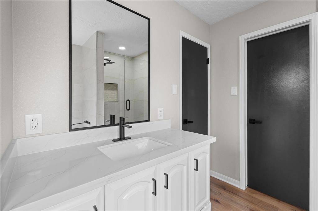 Custom made mirror with vanity going into the huge walk in closet