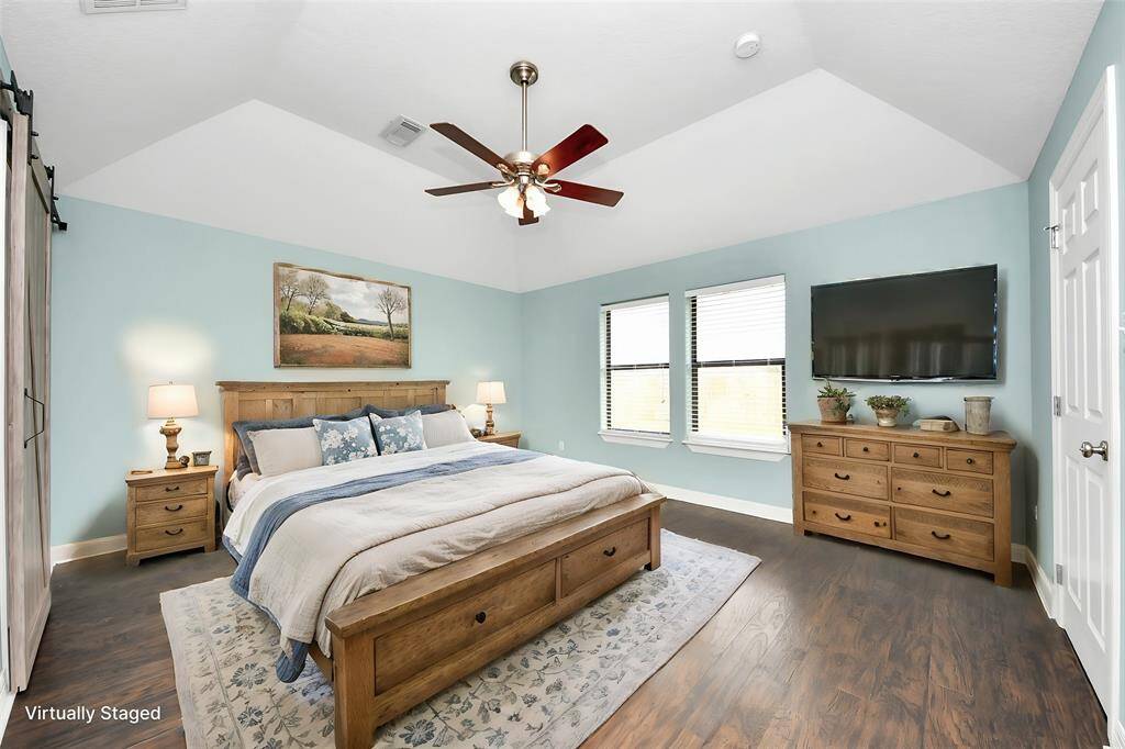 Virtually staged Primary bedroom to show possible design layout.