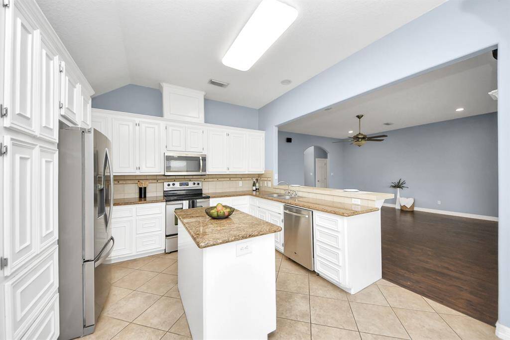 Beautiful, bright Kitchen opens to he living room