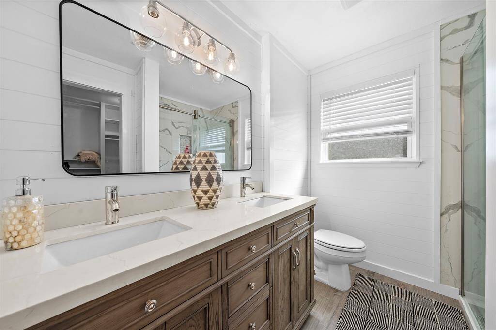 Remodeled bathrooms have quartz countertops