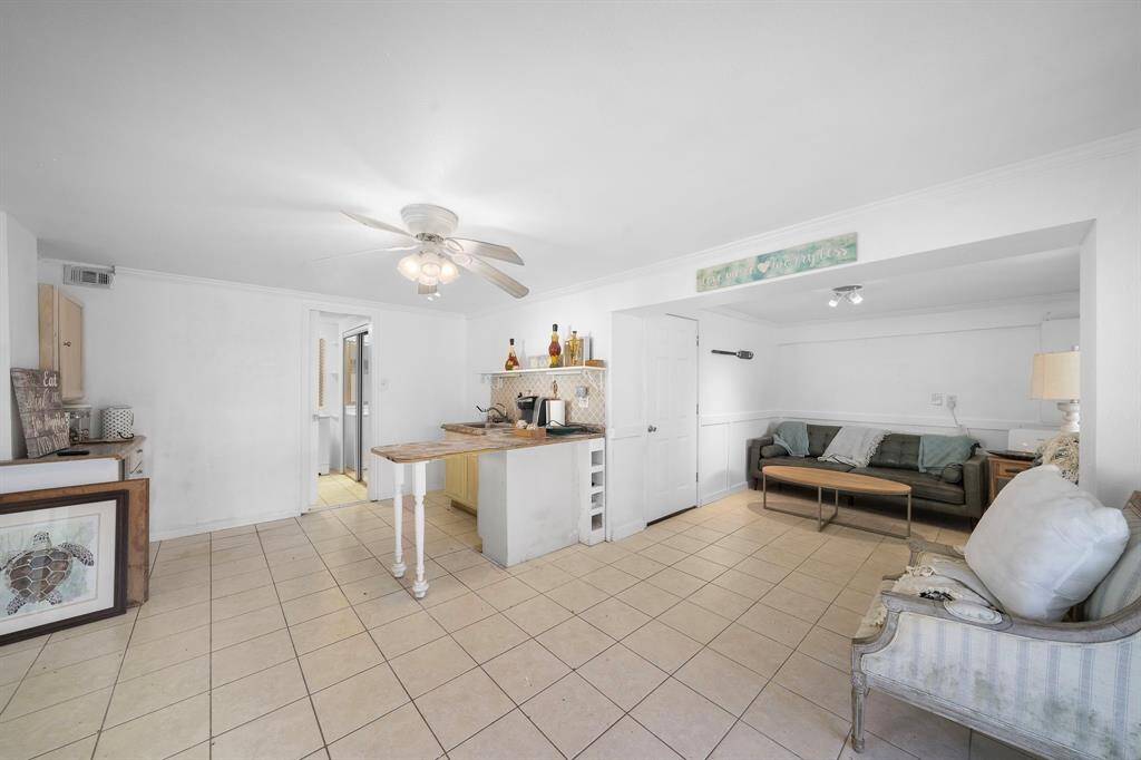 Downstairs room can be used as a bedroom or guest room.  Owner is planning to replace the existing countertop with butcher block and a smaller sink.