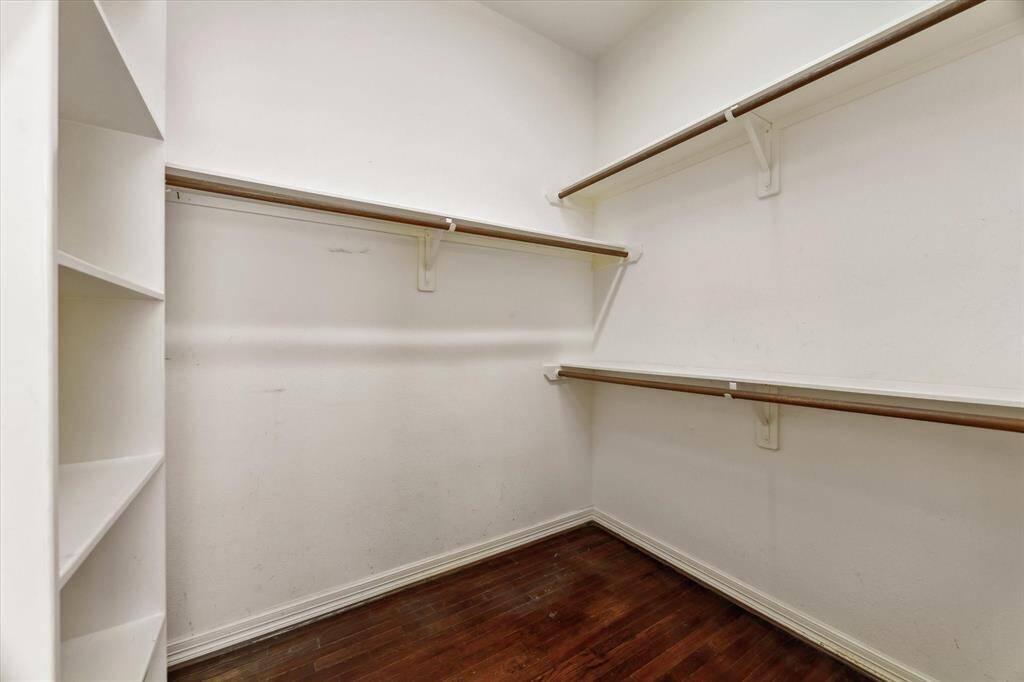 Master closet with cupboard